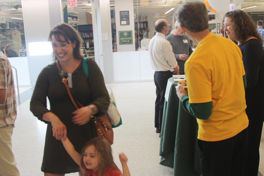 Faculty and friends in the atrium during the Homecoming Open House